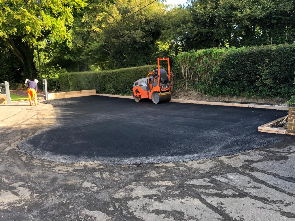 This is a photo of a bitumen driveway which is in the process of being installed by Cowra Road Tek